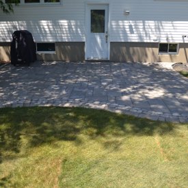 How to Install a Permeable Interlock Patio Next to a Foundation