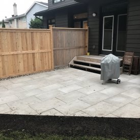 Patio In Backyard with Fence